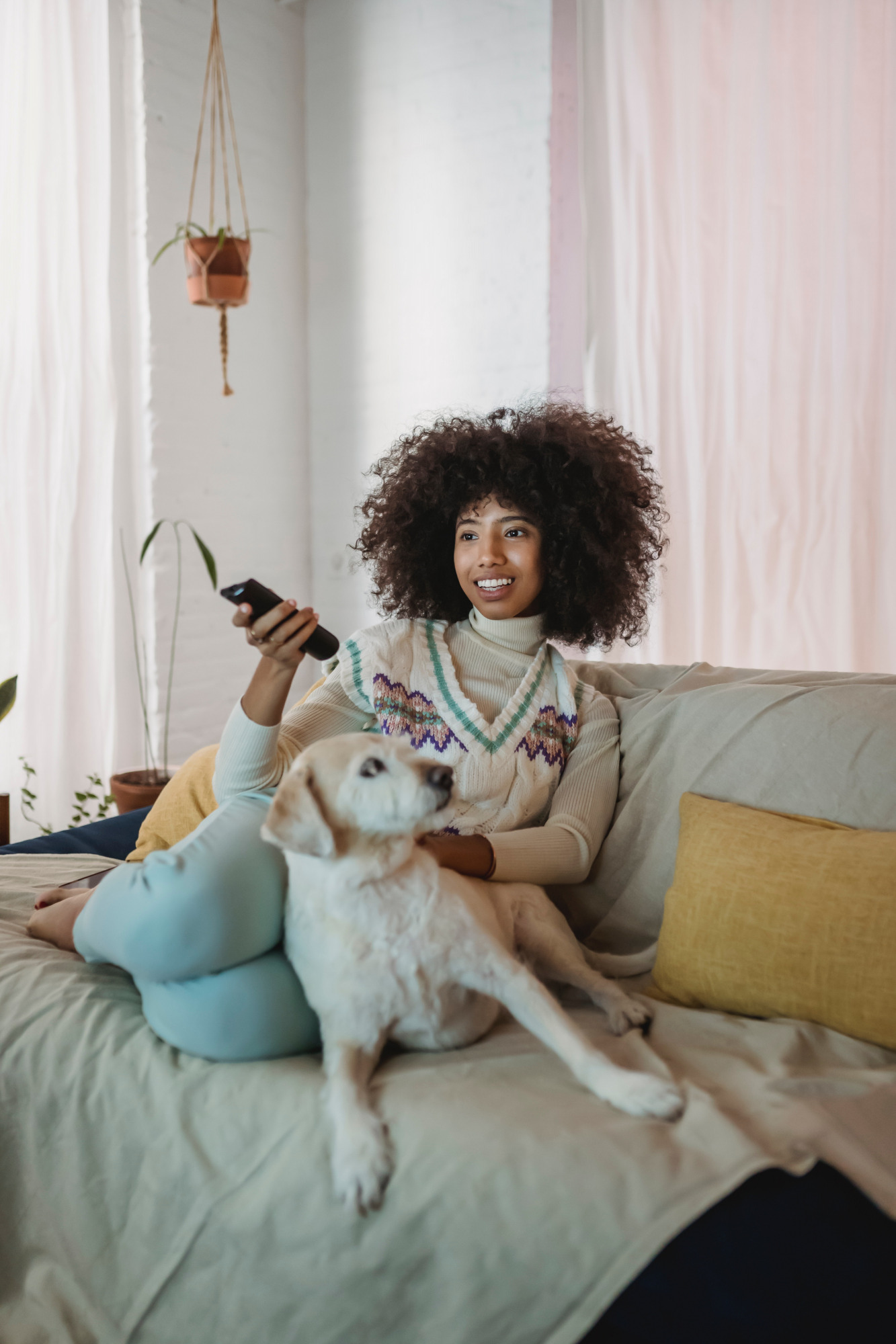 WOMAN WATCHING tv with dog