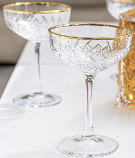 gold-rimmed champagne glasses